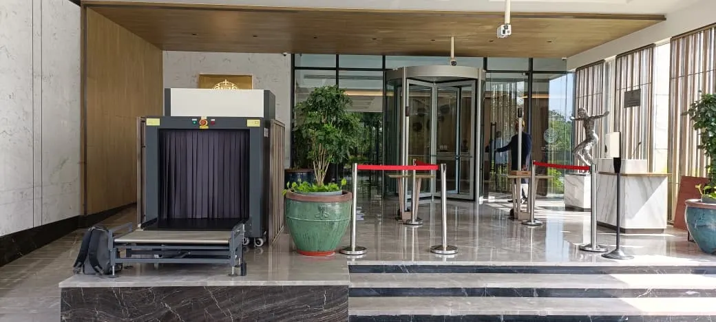 Entrance security installation with baggage scanner and access control