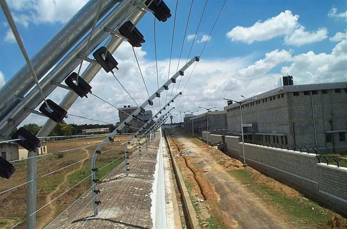 Security fence along industrial boundary